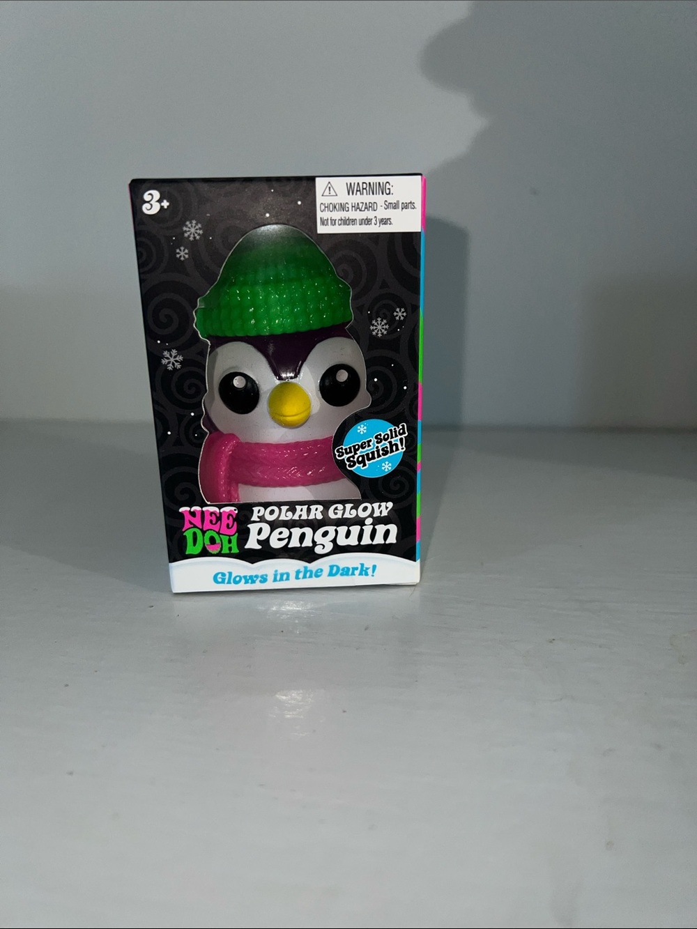 NeeDoh Polar Glow Penguin Plush Toy - Green Hat & Pink Scarf